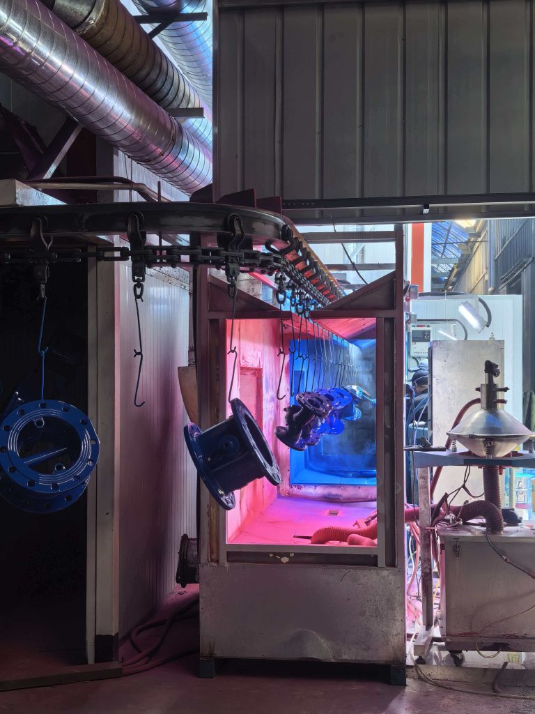 Fusion bonded epoxy FBE coating applied to a ductile iron gate valve